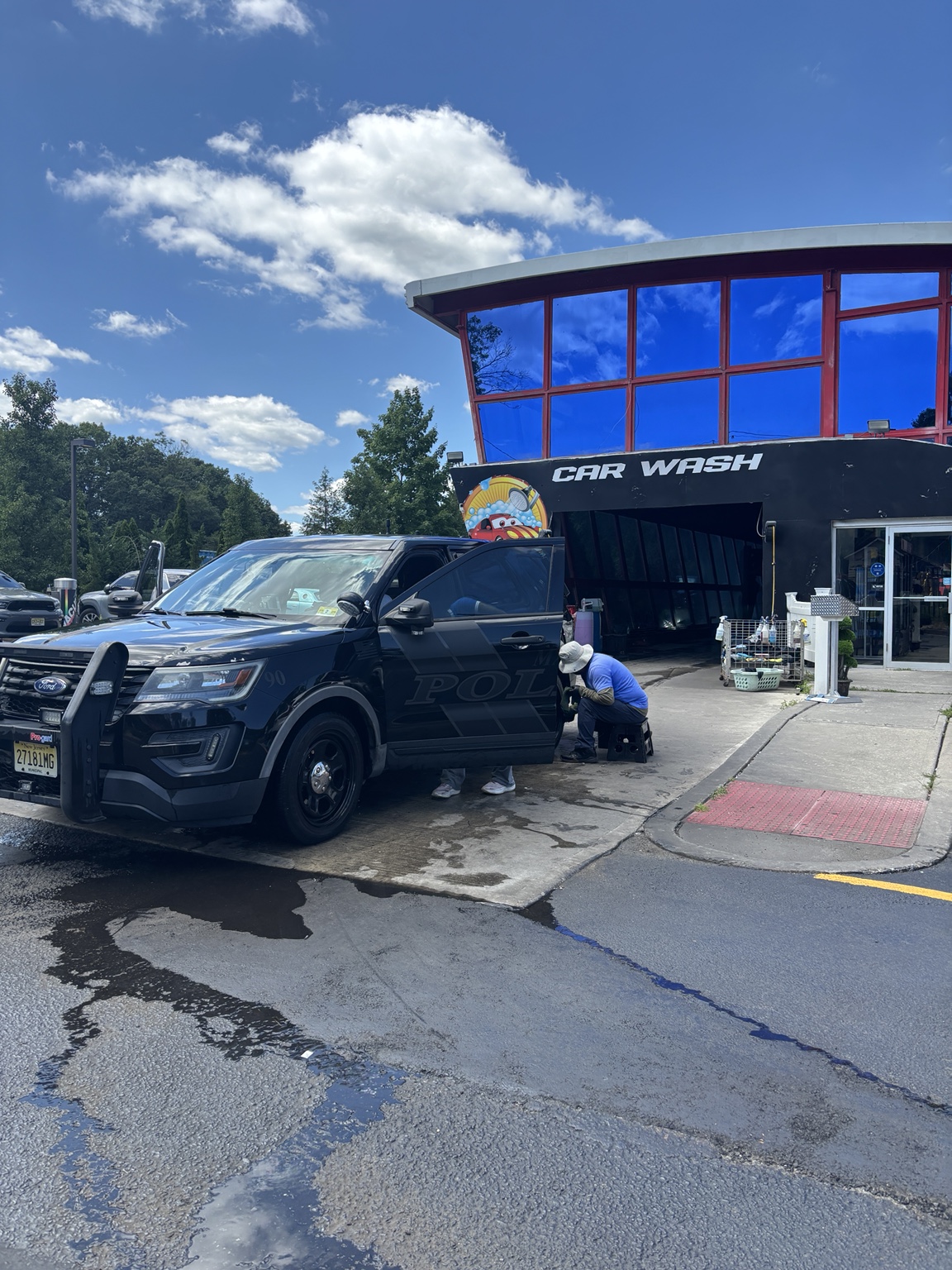 A local police vehicle being professionally cleaned at Car Wash and Beyond in Toms River